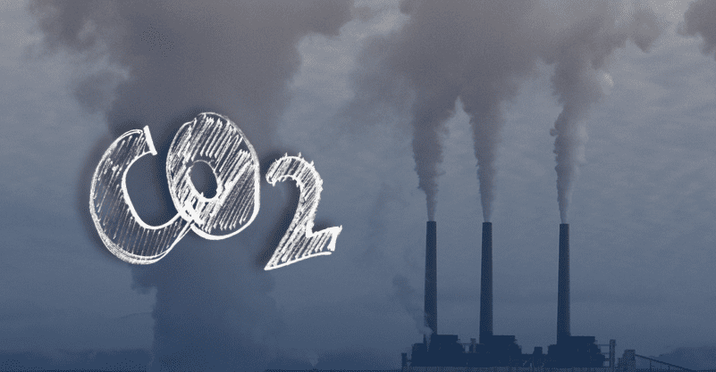 w tle widać fabrykę, związek chemiczny CO2