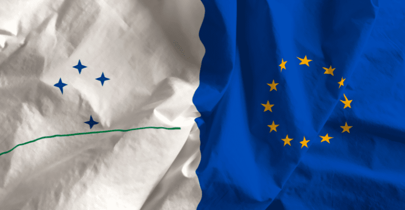 w tle flaga MERCOSUR i Unii Europejskiej