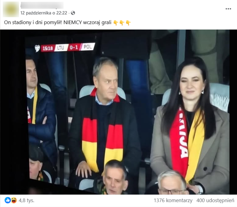 Zrzut ekranu z platformy Facebook, gdzie pojawia się przerobiona fotografia premiera Polski Donalda Tuska, który rzekomo miał mieć na sobie ubrany szalik w niemieckich barwach na meczu Polska-Litwa. Obok Tuska siedzi premier Litwy Inga Ruginienė. 